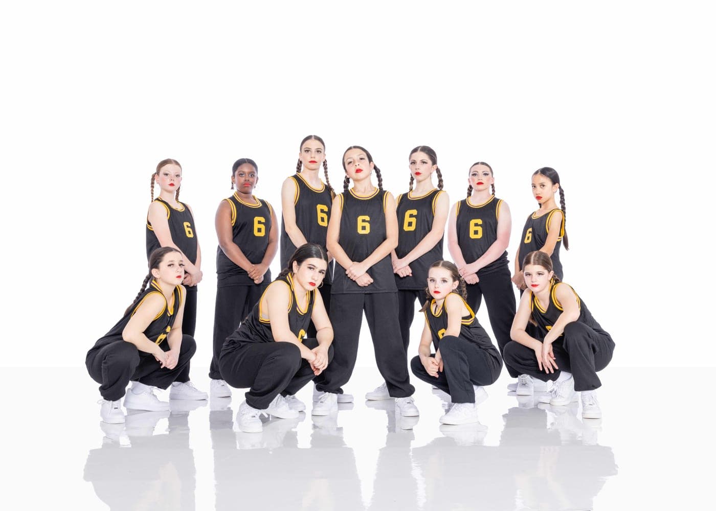 Hip hop team in matching black and gold jerseys